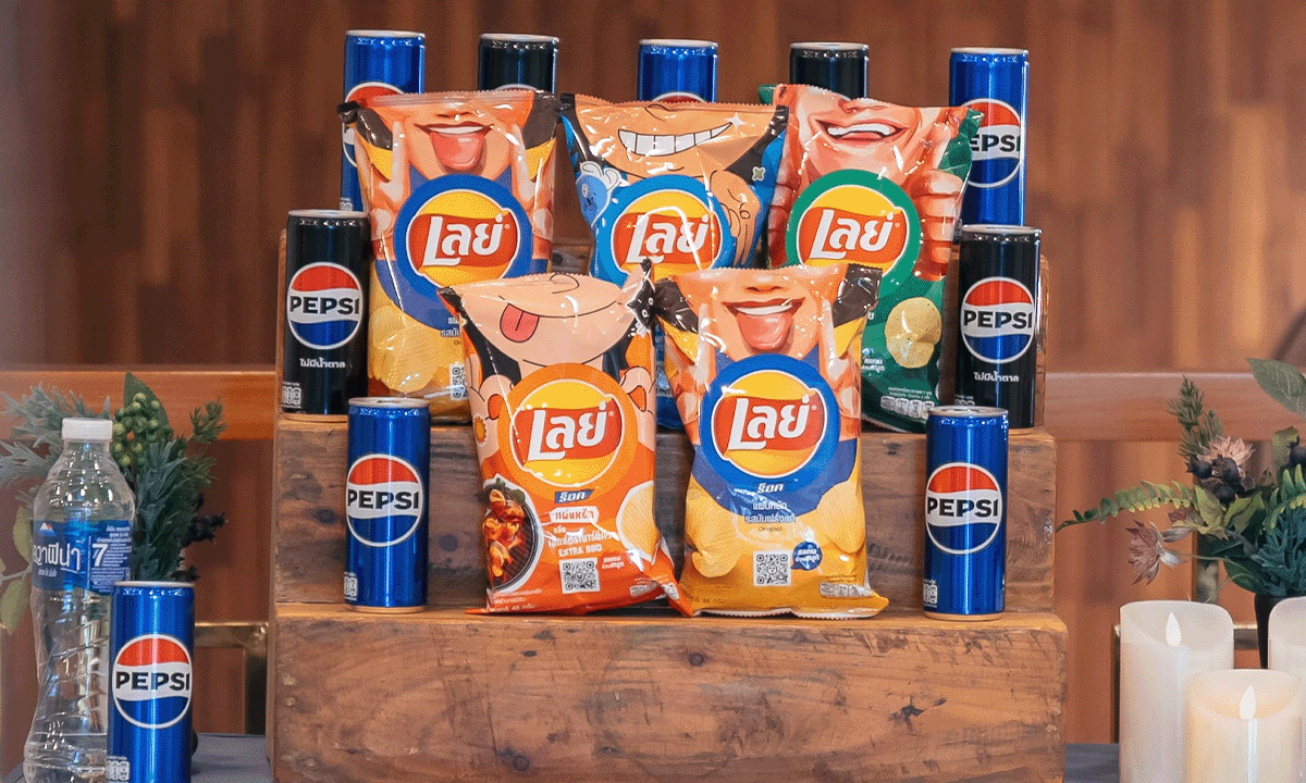 Pepsi cans and Lay's bags sitting on a display with an Aquafina bottle to the side