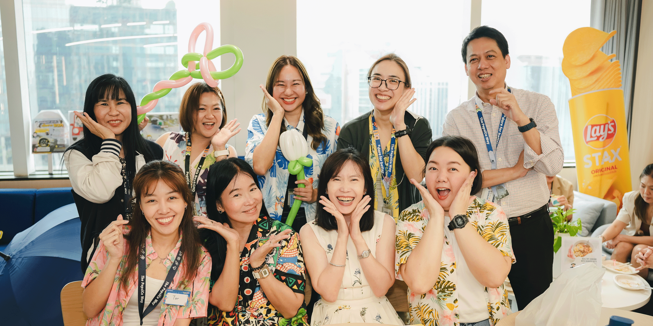 PepsiCo employees posing together at an event